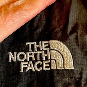 The North Face lightweight front zipper closure hoodie jacket.